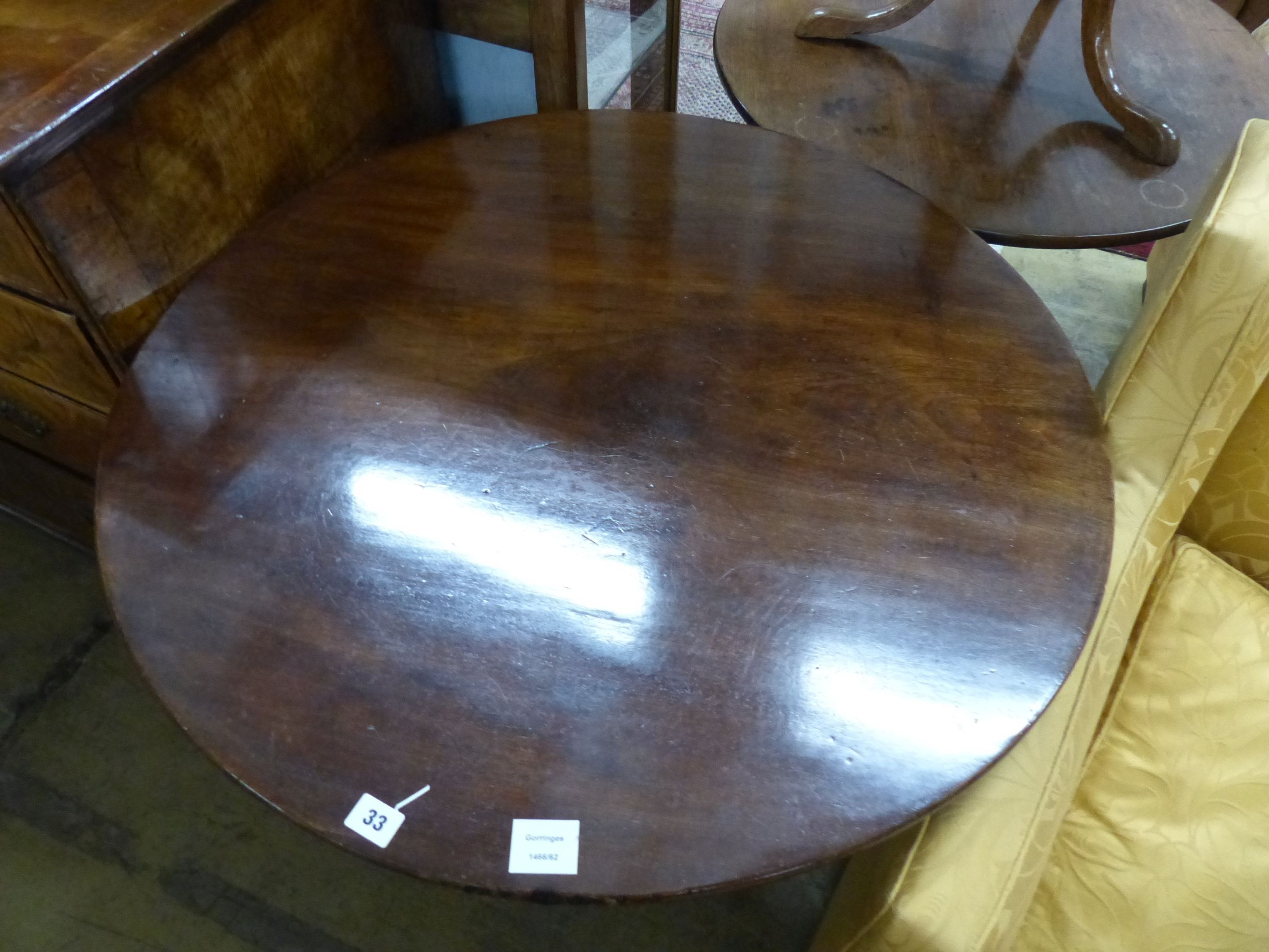 A George III mahogany birdcage tea table, with circular tilt top on wrythen fluted stem, Diam.83cm H.73cm